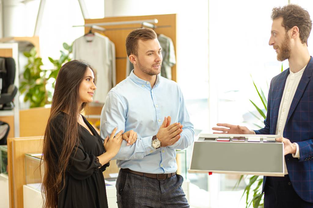 Sales person talking to a couple